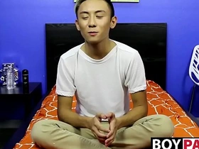 Young Asian man undresses and pleasures himself following a conversation