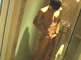 Asian twink soaps up in the shower