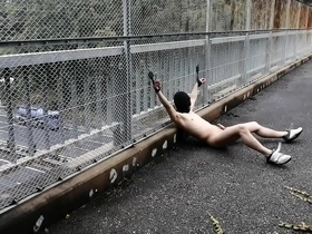Japanese man takes risks on public bridge