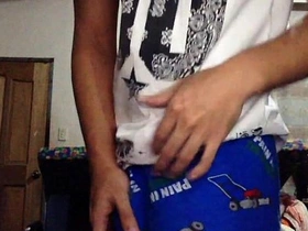 Young Asian jock shows off his muscular body while masturbating
