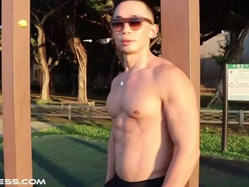 Asian muscle god flaunts his physique outdoors