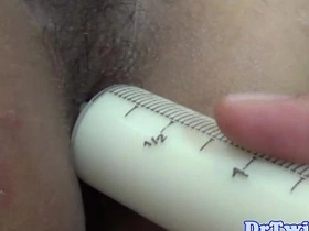 Young Asian twink enjoys creamy enema experience